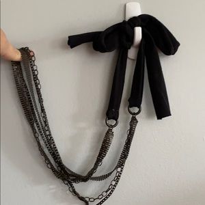Long metal necklace with thick cotton tie